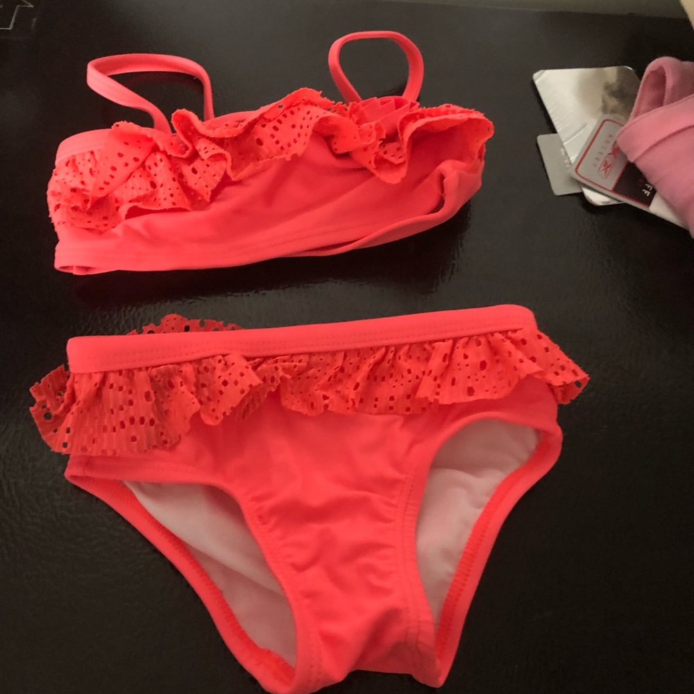 Bright coral bathing suit worn maybe one time